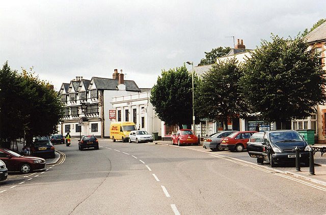 Cullompton High Street with historic buildings lining the road